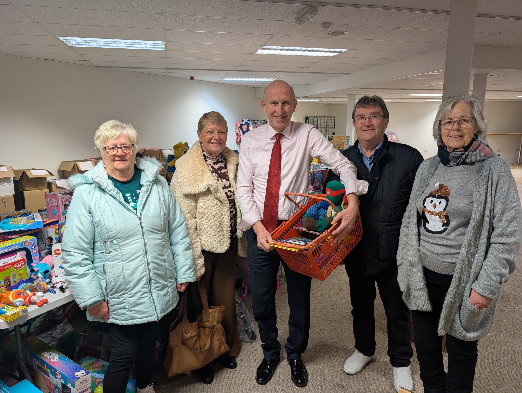 Billy Smith, second from right, with John Healey MP and Rotherham Families First volunteers